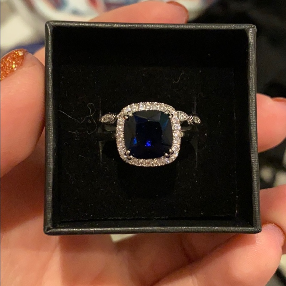Deep blue sapphire and white topaz set of rings